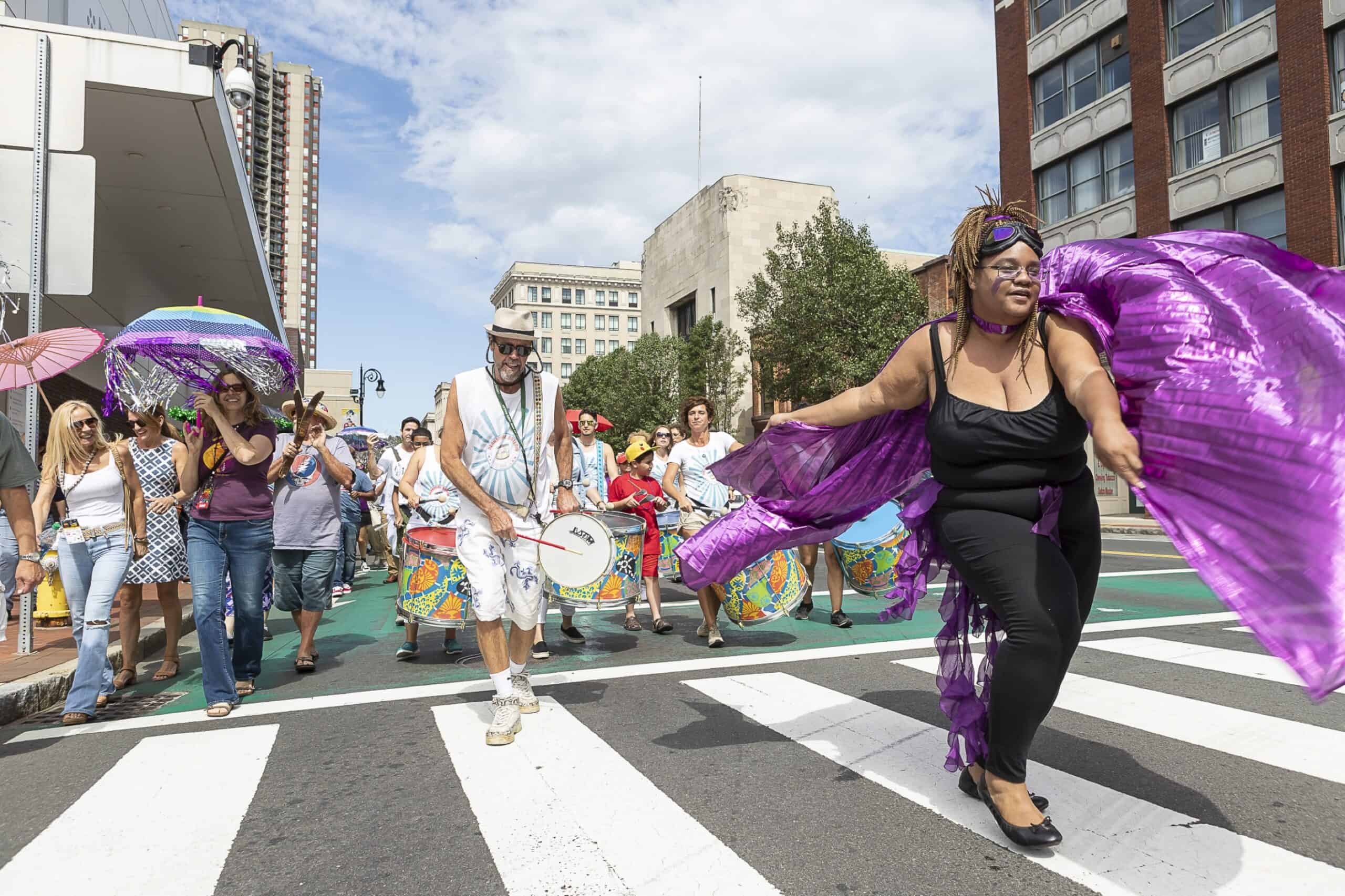 Musicians and dancers taking part in the Second Line Parade through downtown Springfield